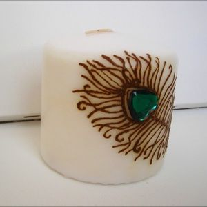 Pillar candle with peacock feather design, new